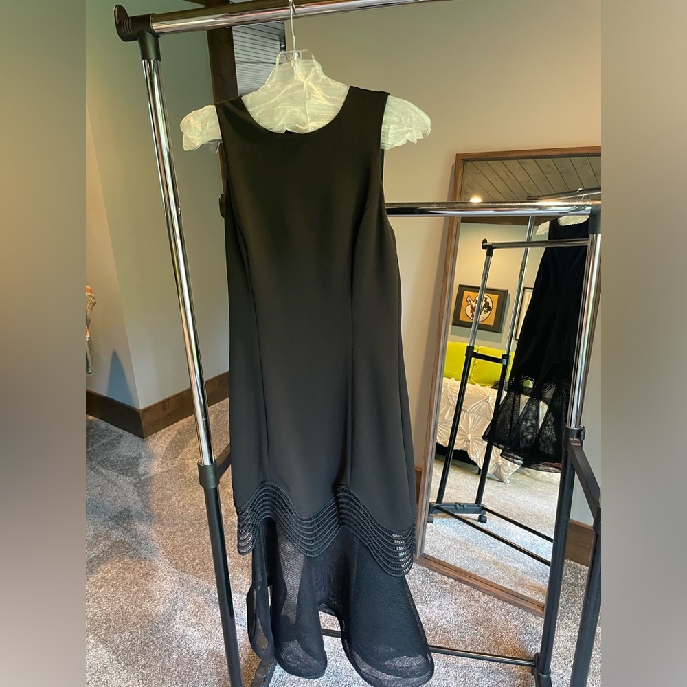 Special occasion formal dress great detail at hem